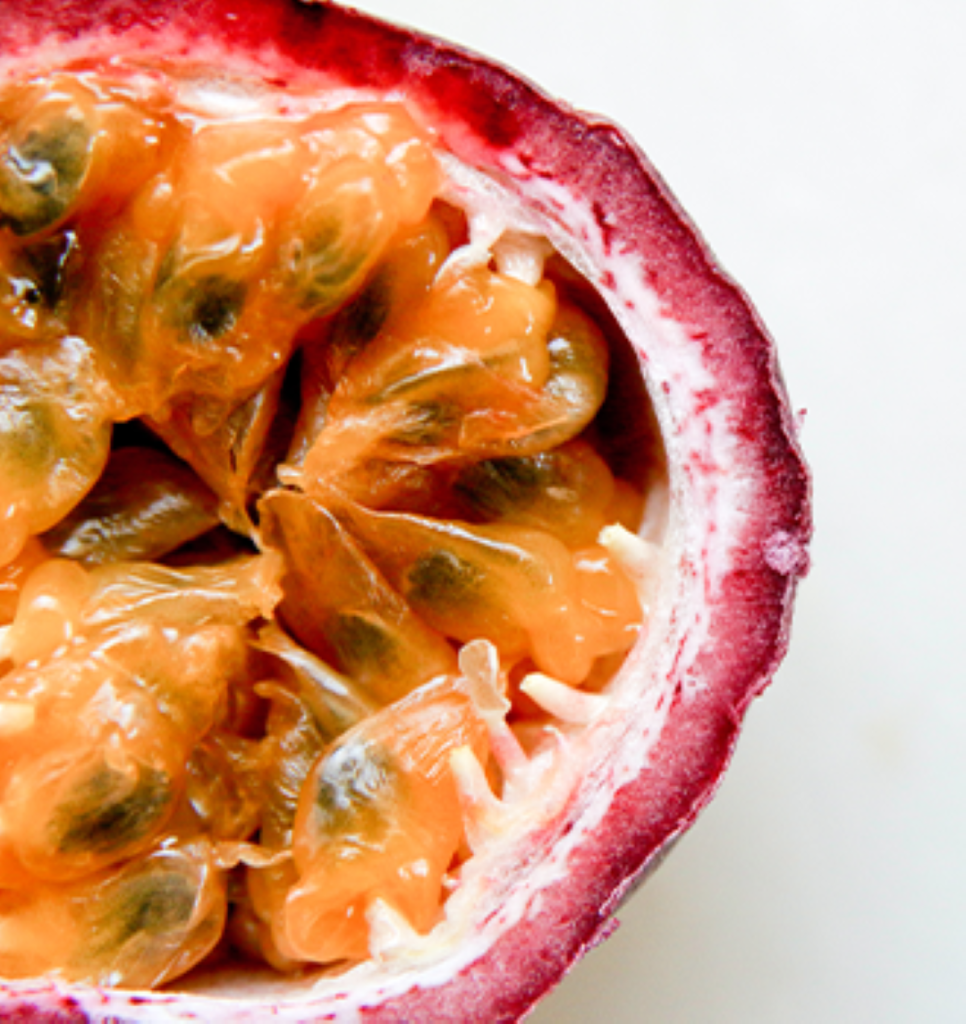 A close op of a passionfruit cut in half